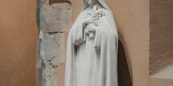 a statue of a woman in a white robe